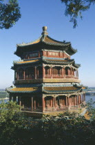 The summer Palace framed by tree branches.Peking Beijing