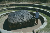 Largest in the World  woman standing next to it.