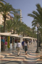 The Explanada de Espana. People walking past shops.  MediterraneanTravelTourismHolidaysMosaicPromenad