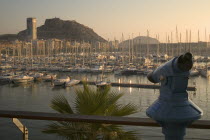 View across the marina with a telescope in the foreground.  MediterraneanTravelTourismHolidaysYachtsMarina