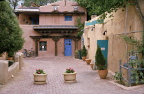 Street with flower tubs and traditional architecture