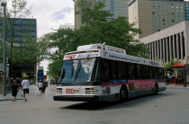 City bus turning street corner