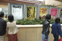 Roppongi Ark Hills Ark Tower. Japanese looking at poster for foreign film Kill Bill