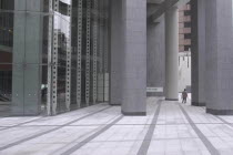 Roppongi "Salariman" officeworker crosses building plaza