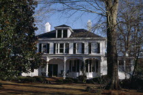 Antebellum Home with rocking chairs on the porch