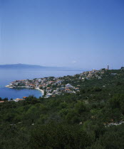 View over coastal town and bay with Hvar Island in the distance