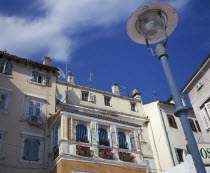 Traditional shuttered houses with window boxes overlooking the harbourRovigno