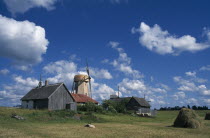 Farm buildings haystack and windmill