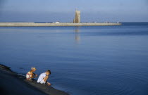 Baltic coastal resort.  Children playing at the edge of water.