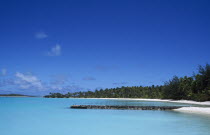 Sandy bay with old flying boat jettyPolynesia