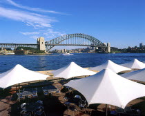 Harbour Bridge with restaurant umbrellas in the foreground