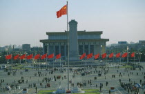 Tiananmen Square with red communist flags.