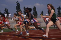 Teenage girls in track event in school championships.