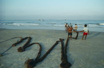 Fishermen hauling nets ashore on Colva beach.Ocean fishingOcean fishing