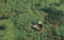 Aerial view over small holdings and farmsteads.