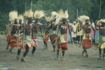 All male traditionally adorned Tutsi intore dancers characterised by coordinated drilling dances reflecting the Tutsi warrior tradition Watutsi