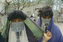 Rashaida nomad women wearing embroidered veils. Mits iwa