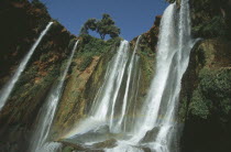 Waterfalls of the Olives.  Multiple falls cascading over rocks with sunlight through spray causing rainbow effect.