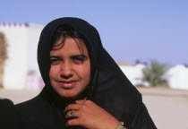 Bedu woman  wearing a black head scarf.