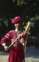 Musician with Tambora instrument.