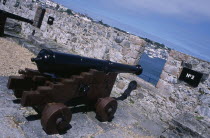 St Peter Port. Castle Cornet. Cannon next to castle wall.