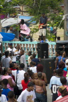 Singer and guitarist by sound system at Easterval Easter Carnival in Clifton