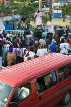 Singer and guitarist with sound system by busy street at Easterval Easter Carnival in Clifton