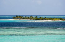 Petit Tobac island with tourists on the beach