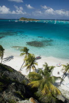 Looking over the Cays and moored yachts towards Canouan on the horizon  from Jamesby Island