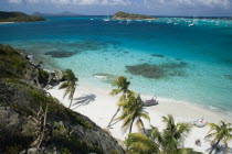 Looking over the Cays and moored yachts towards Canouan on the horizon  from Jamesby Island