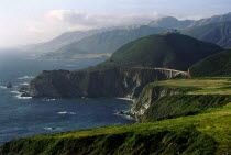 View along coastline that runs along Highway 1 with Bixby Bridge in the distance