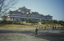 Grand peoples Study House exterior with people.