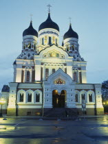 Alexander Nevsky Cathedral facade illuminated at dusk.