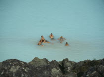 Bathers sitting in the hot water rich in natural minerals.