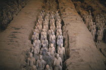 Terracotta warriors in rows in pits at original excavation.