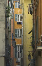 Old Port Area narrow alley way with flat windows and washing hanging