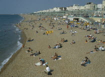 People sitting on the beach in summertime