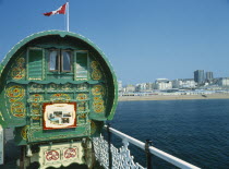 Brighton Pier Gypsy Caravan with Kemptown skyline behind .