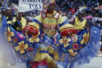 Man in multicoloured costume at traditional harvest festival to celebrate bringing in the sugar cane cropBarbadian West Indies Classic Classical Historical Male Men Guy Older