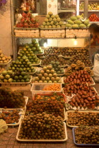 Fruit shop lit up at night