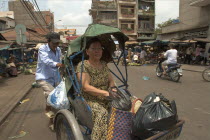 Woman riding in a cyclo