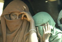 Beja women wearing veils.