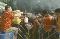 Crowd having a water fight   celebrating the Songkhran Festival. Thai New Year  15 April.