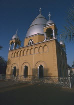 Tomb of the Madhi  Muhammad Ahmad ibn as Sayyid Abd Allah.  Exterior with domed silver roof and decorative wrought iron railings.