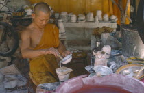 Monk making Buddhist casts.