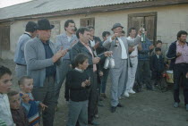 Guests at wedding feast.