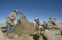 People attending graves during Day of the Dead on November 2nd.