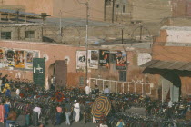 Bicycles and mopeds lined up outside cinema Marrakesh