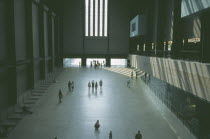 Tate Modern. View over the Old Turbine Hall main entrance with scattering of visitors      Art Galleries