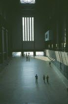 Tate Modern. View over the Old Turbine Hall main entrance with scattered visitors        Art Galleries